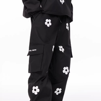 Black outfit with white floral patterns on a white background