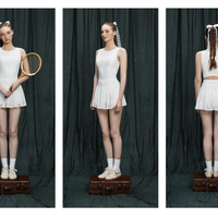 Three views of a person in a white tennis outfit against a black curtain.
