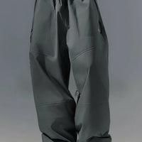 Person wearing gray pants with text 'Explore Boundlessly' on a gray background