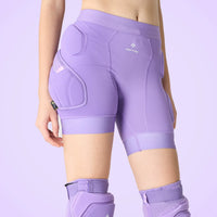 Person wearing purple protective shorts and leggings with 'saffee' branding on a light purple background.