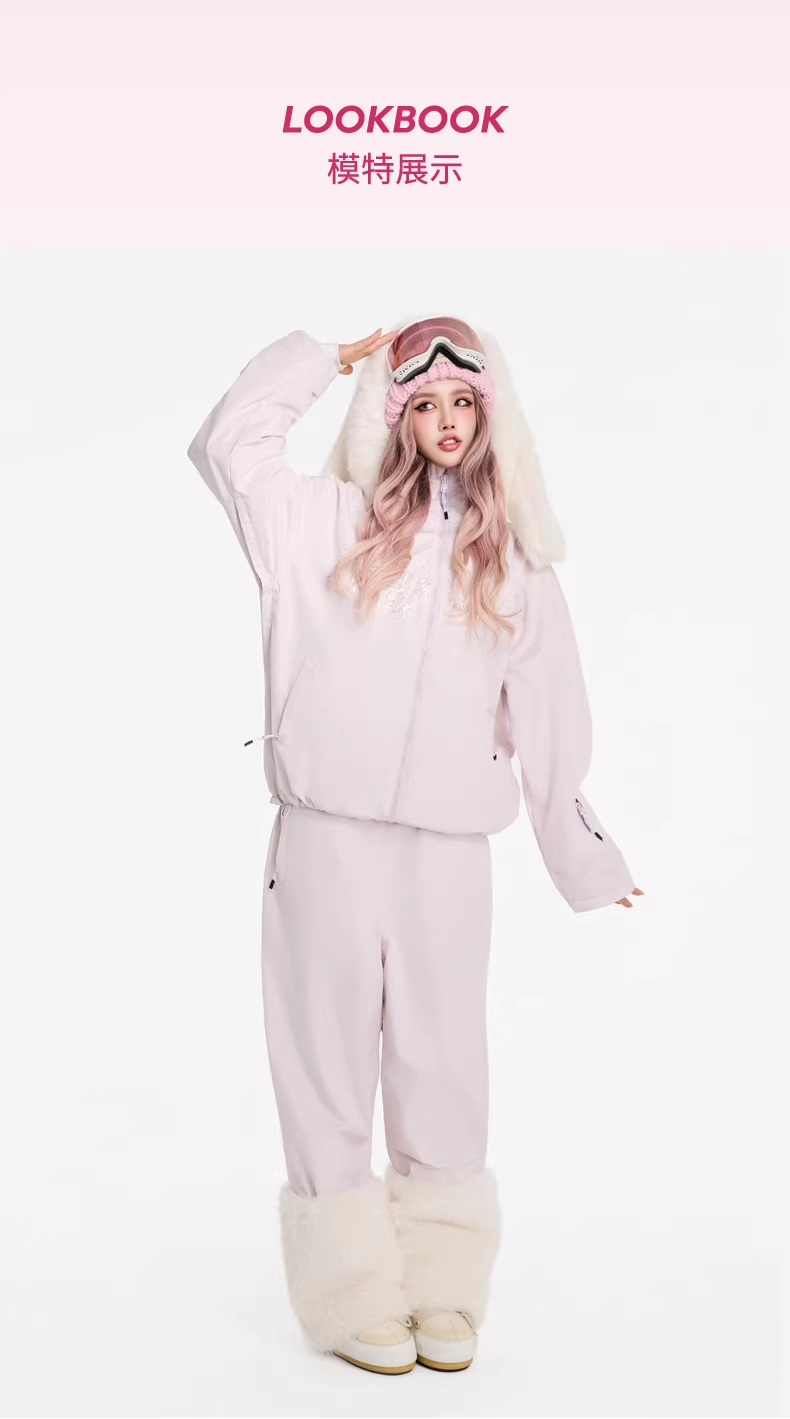 Person wearing a light pink onesie with white fur trim on a white background