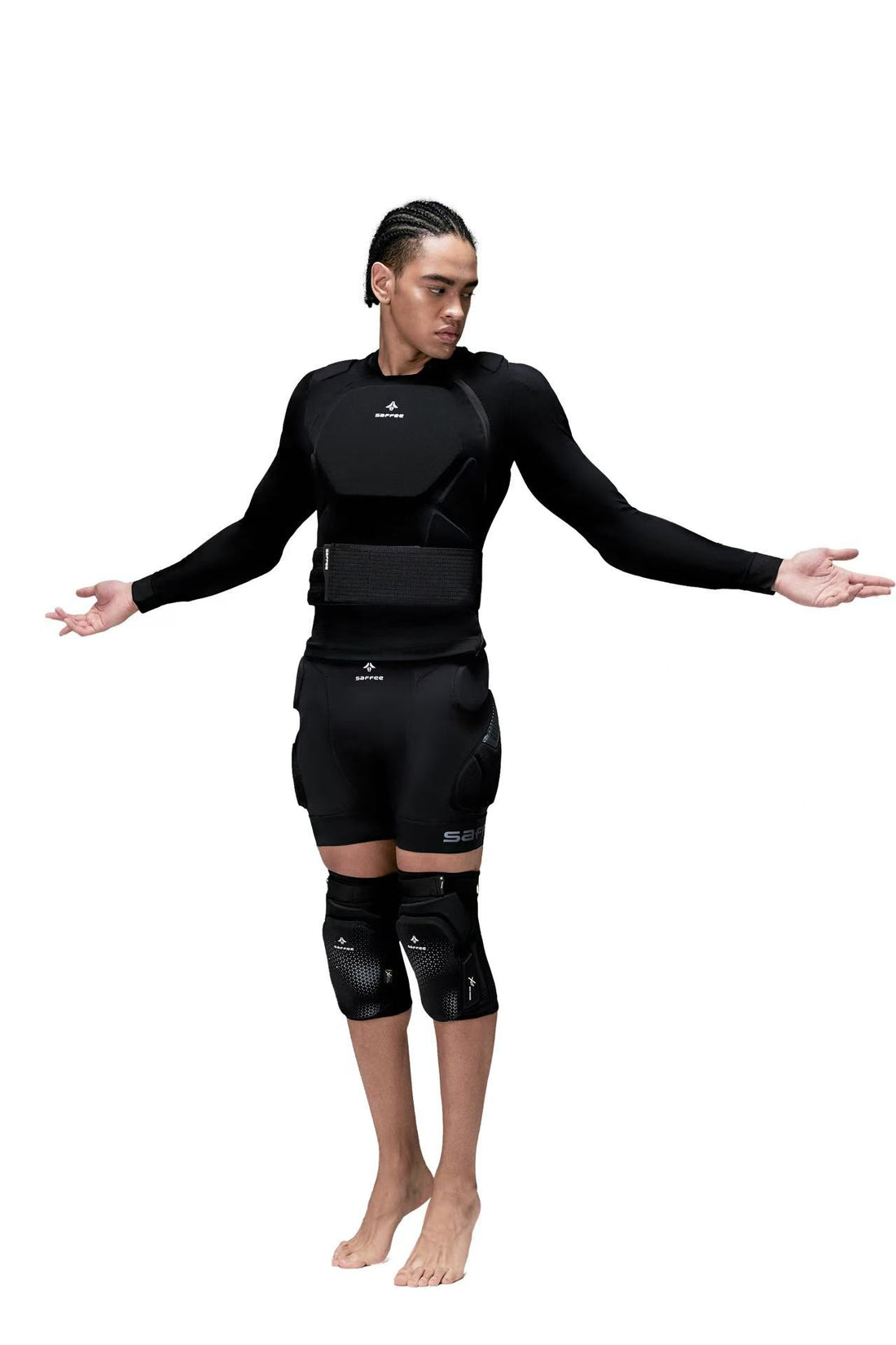 Person wearing a black body armor suit on a white background
