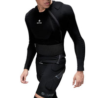 Person wearing a black  protective body armor with visible branding on a white background