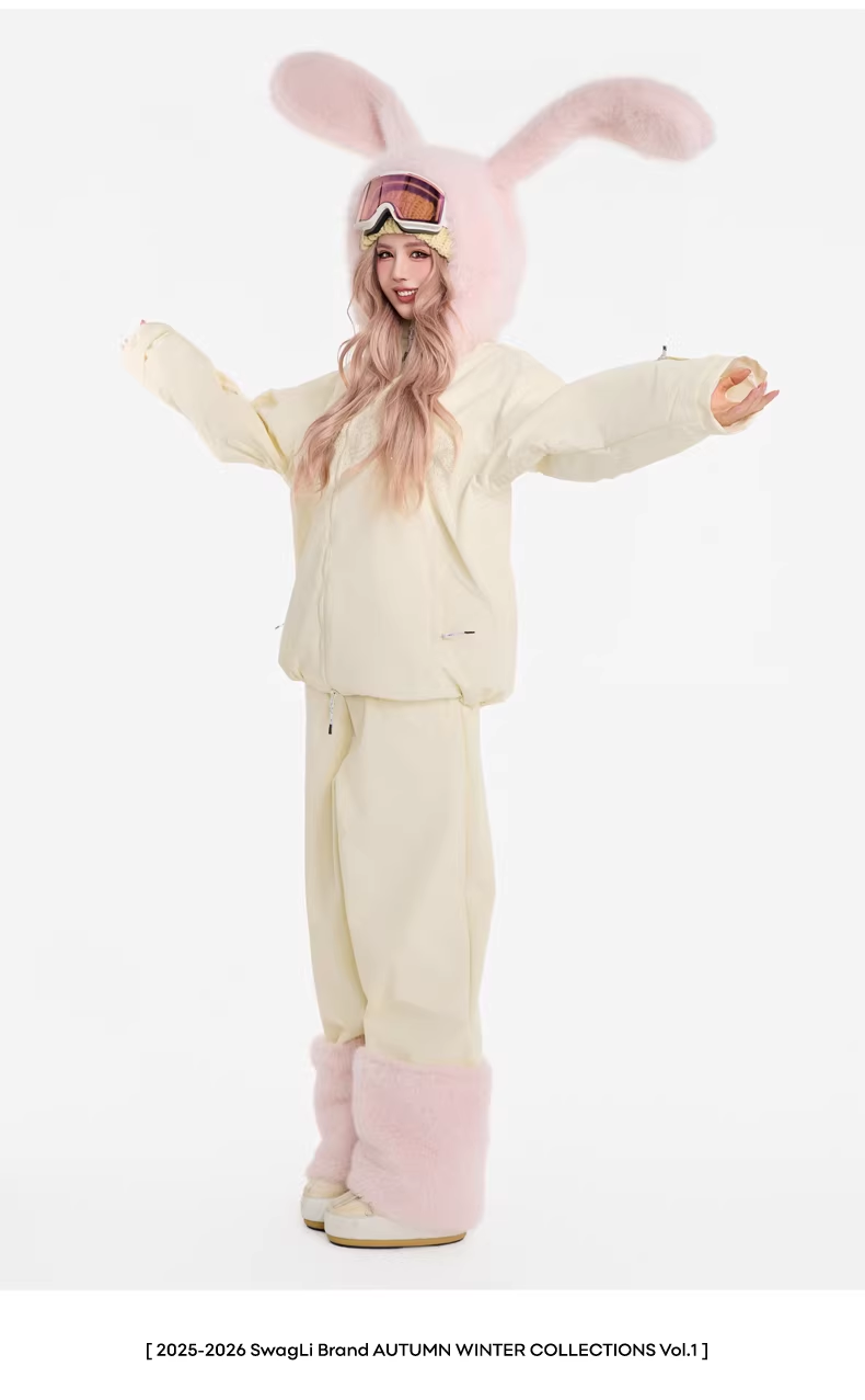 Person wearing a cream-colored bunny costume with pink ears on a white background