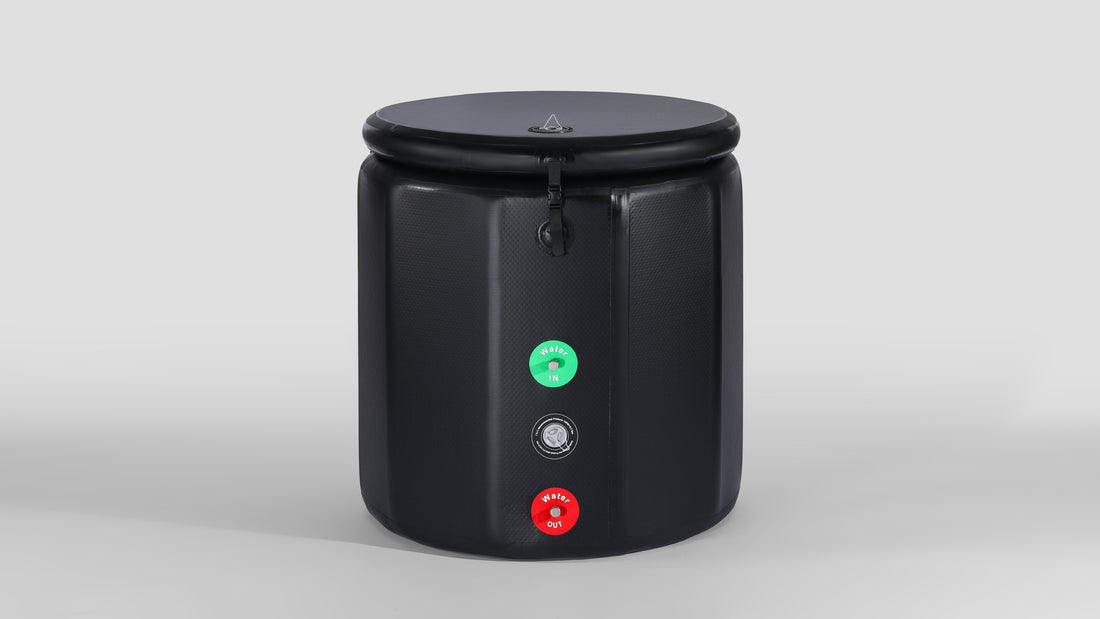 Front view of a black inflatable multi - sided ice bath tub with a lid, featuring inlet and outlet valves for water flow control.