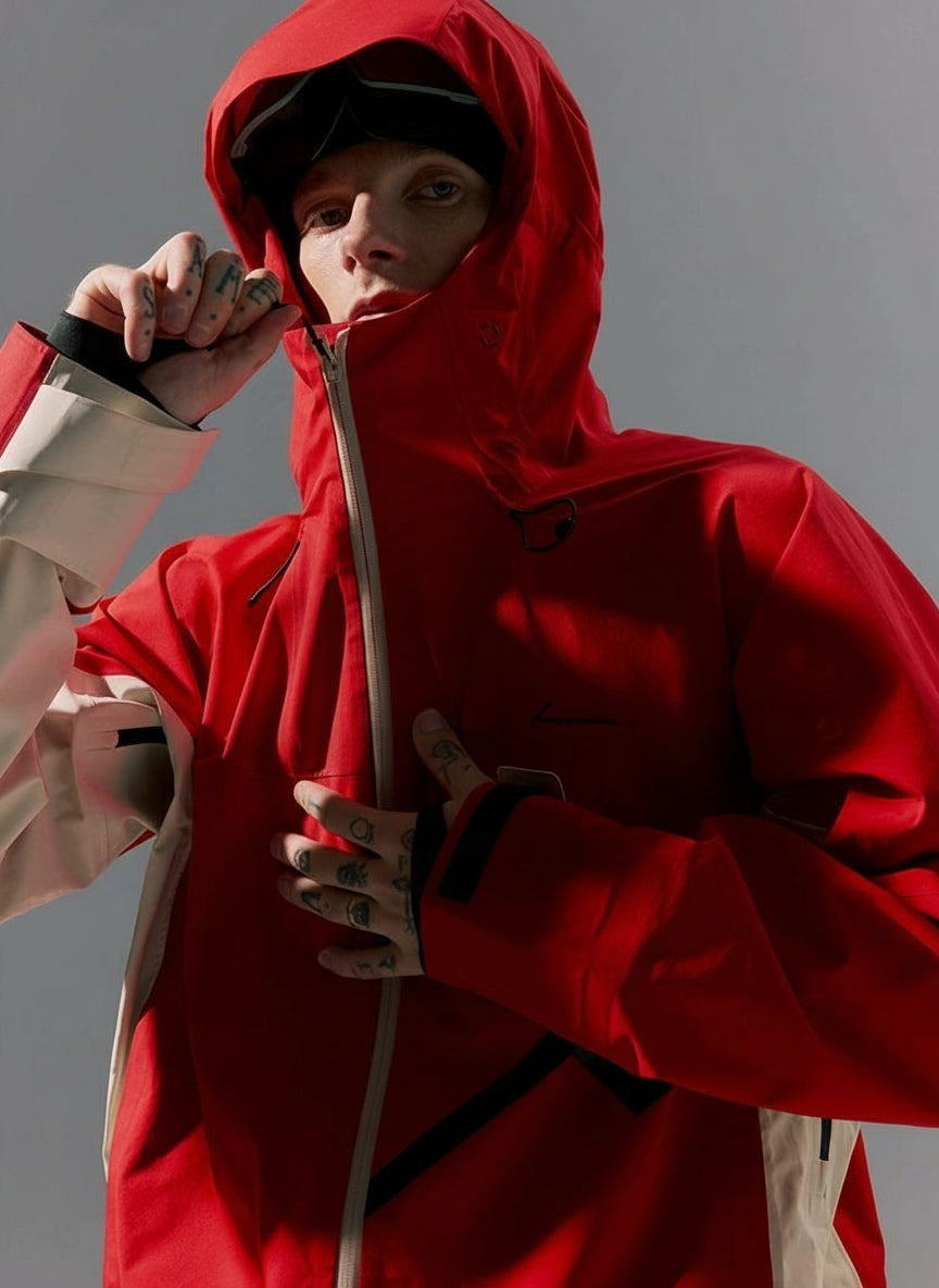 Person wearing a red hooded jacket with text 'Explore Boundlessly' on a gray background