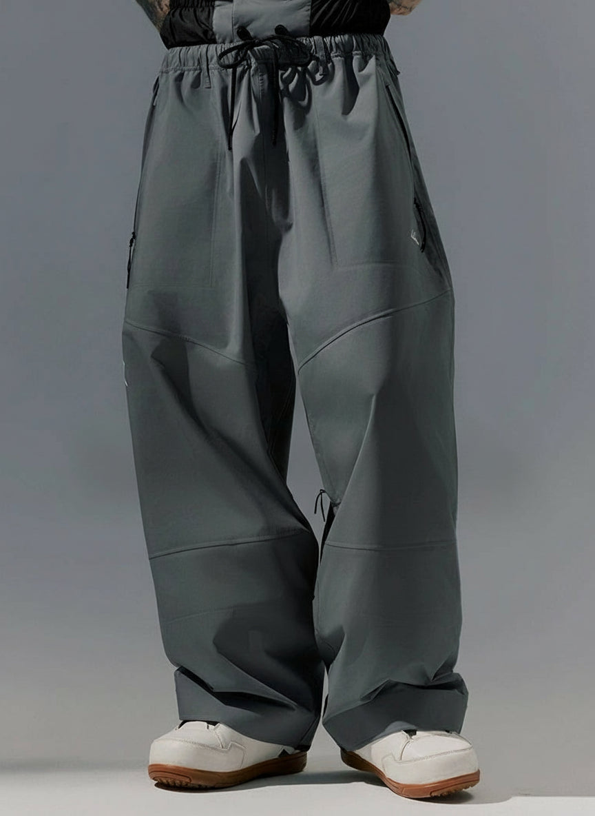 Person wearing gray pants with text &