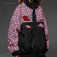Pink leopard print jacket with black accents and visible branding on a gray background