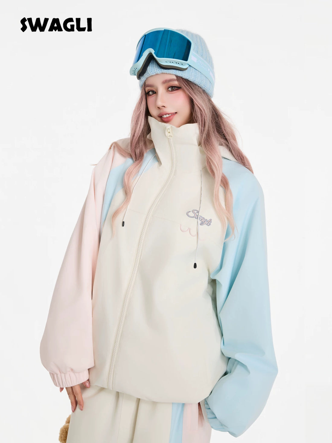 Person wearing a light-colored jacket with 'Swagli' branding, standing against a white background.