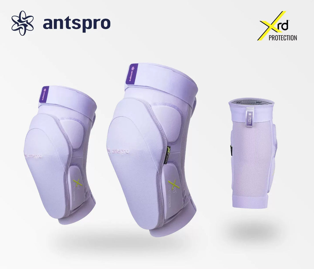 Three Antspro knee support sleeves in a pale lavender-purple color, displayed against a light gray background with Antspro branding and an Xrd Protection logo.