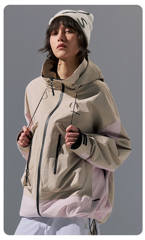 Person wearing a beige jacket on a gray background