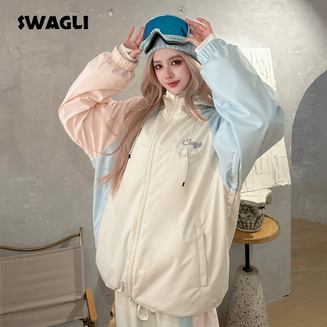 Person wearing a light-colored jacket with a brand logo in the corner