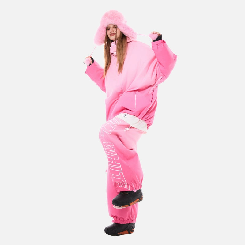 Person wearing a bright pink snowsuit with a hood on a white background