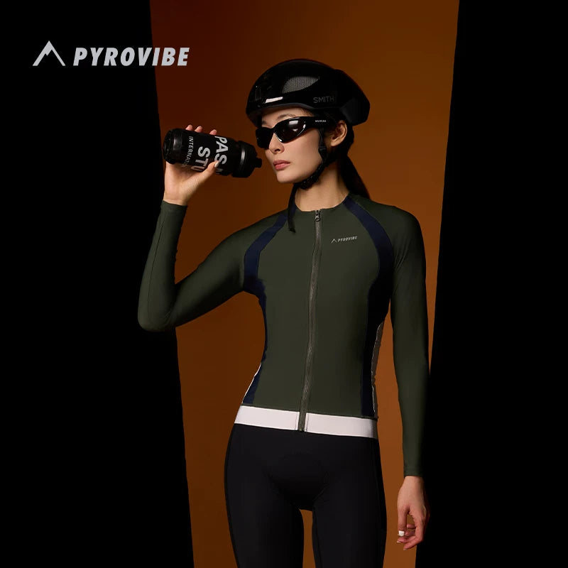 Person wearing a green cycling outfit with helmet and sunglasses, holding a water bottle, against a dark background with &