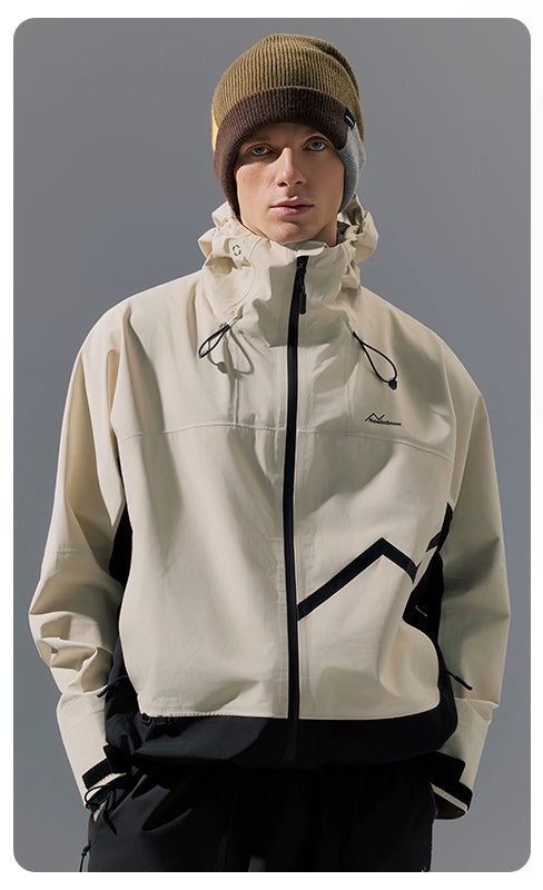Person wearing a beige and black jacket 