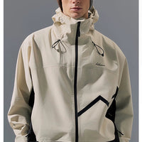 Person wearing a beige and black jacket 