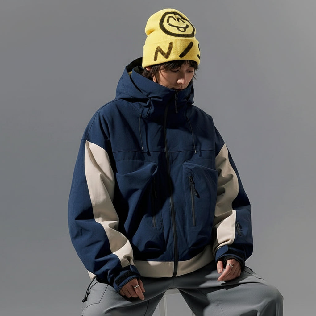 Person wearing a blue raincoat with text and brand logos on a gray background