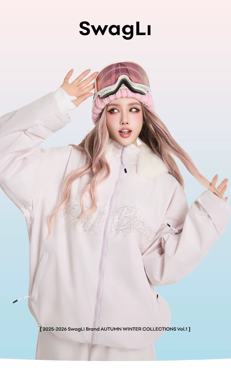 Person wearing a light pink outfit with a matching beanie, posing against a light blue background with &
