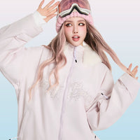 Person wearing a light pink outfit with a matching beanie, posing against a light blue background with 'SwagLi' branding.