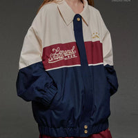 Person wearing a two-tone jacket with 'Lemond Show' branding on a gray background