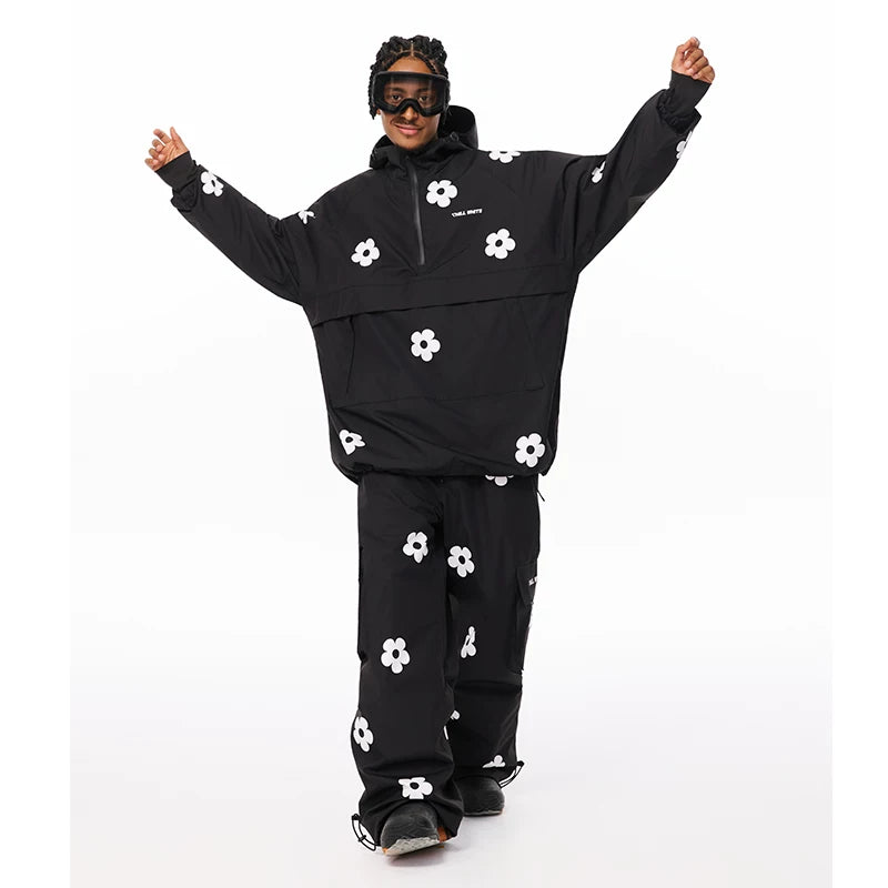 Person wearing a black snowboarding outfit with white floral patterns on a white background