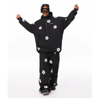 Person wearing a black snowboarding outfit with white floral patterns on a white background