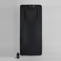 Black Oxford infrared sauna blanket fully extended, featuring vertical zippers for access, control panel with buttons, and power cord for heat therapy.