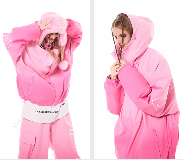 Person wearing a pink onesie with a hood and text on a white background